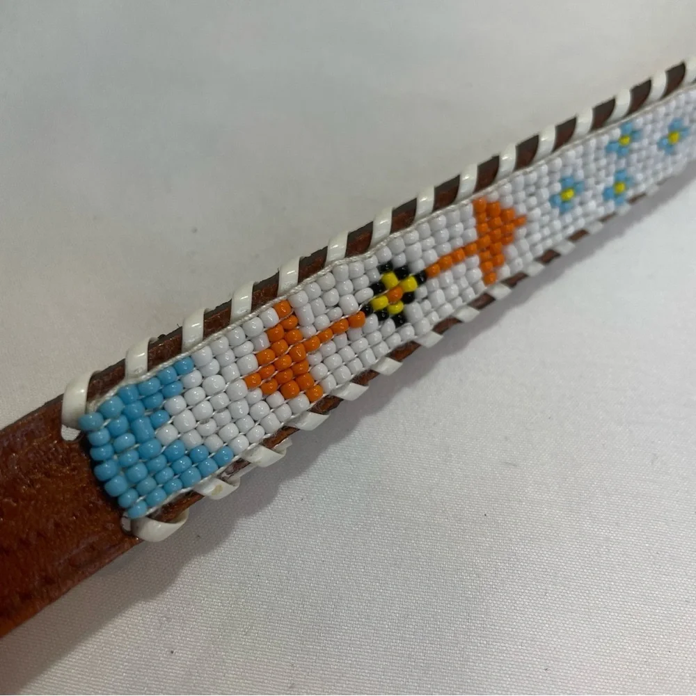 Child’s brown tribal beaded belt. Braided edge. Size 28. Pre-owned. Eagle. Arrow
